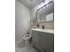 Stylish bathroom with gray vanity, modern faucet, and elegant decor at 1126 Williamsburg Ln, Norcross, GA 30093