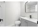 Bathroom with modern vanity, sleek mirror, and shower-tub combo at 1126 Williamsburg Ln, Norcross, GA 30093
