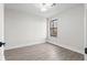 Bright bedroom features wood-look floors and natural light from the window at 1126 Williamsburg Ln, Norcross, GA 30093