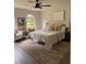 Cozy bedroom with neutral tones, stylish furniture, and a large window at 1126 Williamsburg Ln, Norcross, GA 30093