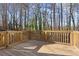 Wooden deck with wood railings and a lush view at 1126 Williamsburg Ln, Norcross, GA 30093