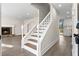 Inviting entryway showcases staircase, fireplace, and modern finishes throughout the home at 1126 Williamsburg Ln, Norcross, GA 30093