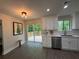 Bright kitchen with white cabinets, stainless appliances and backyard views at 1126 Williamsburg Ln, Norcross, GA 30093