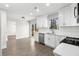 Open kitchen with backyard deck access, white cabinets, and stainless appliances at 1126 Williamsburg Ln, Norcross, GA 30093