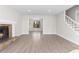 Spacious living room features wood-look floors, fireplace, and natural light at 1126 Williamsburg Ln, Norcross, GA 30093