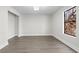 Minimalist room with recessed lighting, neutral walls, and modern flooring at 1126 Williamsburg Ln, Norcross, GA 30093