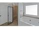 Bathroom with soaking tub and walk-in shower at 149 Elkins Blvd, Locust Grove, GA 30248