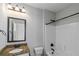 Clean bathroom with shower/tub combo and granite vanity at 149 Elkins Blvd, Locust Grove, GA 30248