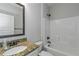 Clean bathroom with granite vanity, bathtub, and shower at 149 Elkins Blvd, Locust Grove, GA 30248