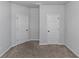 Spacious bedroom with neutral carpeting and ample closet space at 149 Elkins Blvd, Locust Grove, GA 30248