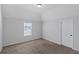 Well-lit bedroom featuring a window and neutral decor at 149 Elkins Blvd, Locust Grove, GA 30248