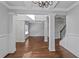 Spacious dining room features hardwood floors, columns and a chandelier at 149 Elkins Blvd, Locust Grove, GA 30248