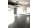 Spacious garage with epoxy floor and windows at 149 Elkins Blvd, Locust Grove, GA 30248