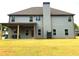 Two story home exterior with covered patio at 149 Elkins Blvd, Locust Grove, GA 30248