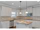Modern kitchen with white cabinets and granite countertops at 149 Elkins Blvd, Locust Grove, GA 30248