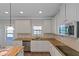 Modern kitchen with white cabinets and granite countertops at 149 Elkins Blvd, Locust Grove, GA 30248
