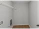 Bright laundry room with shelving and tile floor at 149 Elkins Blvd, Locust Grove, GA 30248