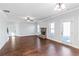 Open living area with hardwood floors, fireplace, and sliding glass doors at 149 Elkins Blvd, Locust Grove, GA 30248