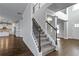Elegant staircase with wrought-iron railing leading to an upper level at 149 Elkins Blvd, Locust Grove, GA 30248