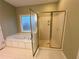 Bathroom with shower and tub at 3648 Clark Hill Way, Buford, GA 30519