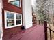 Red wooden deck overlooks backyard and wooded area at 3648 Clark Hill Way, Buford, GA 30519