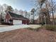 Attached garage with a red brick exterior at 3648 Clark Hill Way, Buford, GA 30519