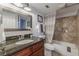 Updated bathroom with granite vanity and tile shower/tub combo at 41 Doranne Se Ct, Smyrna, GA 30080