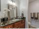 Bathroom features dark granite countertop and updated vanity at 41 Doranne Se Ct, Smyrna, GA 30080