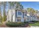 Side view of charming light blue townhome nestled in trees at 41 Doranne Se Ct, Smyrna, GA 30080