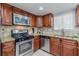 Updated kitchen with stainless steel appliances and wood cabinets at 41 Doranne Se Ct, Smyrna, GA 30080