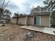 Home's exterior back of the house with a sliding door and concrete slab at 22 Cardinal Ln, Jonesboro, GA 30238