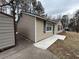 Charming home with a side shed and a concrete walkway to the entrance at 22 Cardinal Ln, Jonesboro, GA 30238