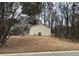 A exterior side view of the home shows a well maintained lawn and foliage at 22 Cardinal Ln, Jonesboro, GA 30238