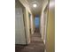 Hallway with gray wood floors and neutral paint at 22 Cardinal Ln, Jonesboro, GA 30238