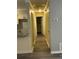 Hallway with wood-look floors and yellow walls at 22 Cardinal Ln, Jonesboro, GA 30238