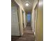 The hallway is long with hardwood floors and white doors leading to various rooms at 22 Cardinal Ln, Jonesboro, GA 30238