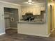 Cozy kitchen featuring granite countertops, stainless steel appliances, and ample cabinet space at 22 Cardinal Ln, Jonesboro, GA 30238