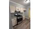 The kitchen features granite countertops, stylish cabinetry, modern flooring, and stainless steel appliances at 22 Cardinal Ln, Jonesboro, GA 30238
