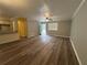 Inviting living room features modern flooring, a ceiling fan, and seamlessly connects to the dining area and kitchen at 22 Cardinal Ln, Jonesboro, GA 30238