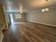 Open-concept living room boasts wood-look floors, natural light, and ceiling fan at 22 Cardinal Ln, Jonesboro, GA 30238