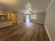 Spacious living room features wood-look flooring, plenty of natural light, and a ceiling fan at 22 Cardinal Ln, Jonesboro, GA 30238