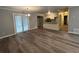 A spacious open living area that offers stylish wood-look flooring and ample natural light at 22 Cardinal Ln, Jonesboro, GA 30238