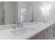 Modern bathroom with double vanity, quartz countertop, and glass shower at 1072 Green St, Roswell, GA 30075