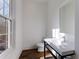 Modern bathroom with white vanity, floating sink, and dark wood floors at 1072 Green St, Roswell, GA 30075