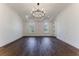 Large bedroom with hardwood floors and a chandelier at 1072 Green St, Roswell, GA 30075