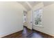 Bedroom with hardwood floors and a view of trees at 1072 Green St, Roswell, GA 30075