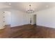 Primary bedroom with hardwood floors and access to other rooms at 1072 Green St, Roswell, GA 30075