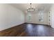 Spacious bedroom featuring hardwood floors and a chandelier at 1072 Green St, Roswell, GA 30075