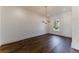 Spacious dining room featuring hardwood floors and a modern chandelier at 1072 Green St, Roswell, GA 30075