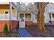 Townhome exterior with front porch and landscaping at 1072 Green St, Roswell, GA 30075